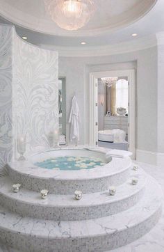 a white bathroom with a large jacuzzi tub