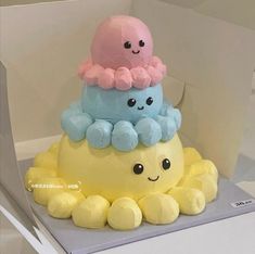 there is a cake that looks like an octopus and jellyfish on top of each other