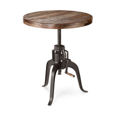 an industrial style table with wheels on the legs and a wooden top, sitting against a white background