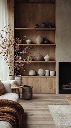 a living room filled with furniture and a fire place