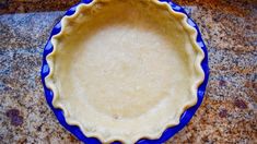 an uncooked pie crust in a blue bowl