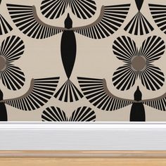 an art deco style wallpaper with black and white designs on the side of it