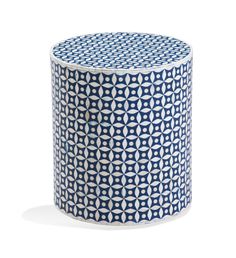 a blue and white vase sitting on top of a table