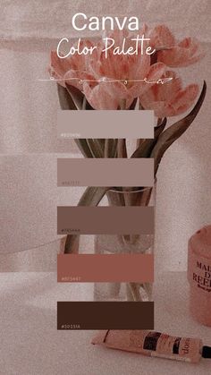 a pink flower sitting in a vase next to a tube of paint and a pen