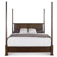 a bed with four posts and pillows on it's headboard, against a white background