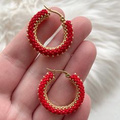 💖 Add a pop of color to your outfit with these red & gold seed bead hoop earrings! These beaded hoop earrings are perfect for adding a touch of fun to any look, whether you're dressing up for Halloween or looking for a unique Christmas gift for your best friend. Stand out from the crowd and show off your unique style with these eye-catching earrings! These handmade hoop earrings are not only stylish but also comfortable to wear all day long * MATERIALS * Hoops are made of high quality Japanese seed beads. Because of it's shape there is no space between each bead in work. Each jewelry looks like it's made of metal not of glass These earrings have latch back stainless steel closure. It doesn't tarnish and causes no allergy 📐 MEASUREMENTS * Earrings diameter: 1.1 inches or 28 mm Care instru Small Hoop Beaded Earrings With Spacer Beads For Gifts, Trendy Handmade Hoop Beaded Earrings, Small Hoop Beaded Earrings With Spacer Beads As Gift, Trendy Colorful Beaded Hoop Earrings For Gifts, Gift Dangle Hoop Earrings With Spacer Beads, Handmade Round Jewelry For Christmas, Handmade Round Christmas Jewelry, Trendy Hoop Beaded Earrings As Gift, Gift Hoop Beaded Earrings