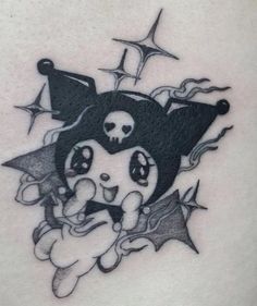 a black and white image of a cartoon character on the back of a woman's stomach