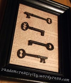 four old keys in a shadow frame on a table next to a wall with the words,