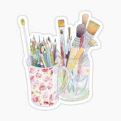 watercolor pencils and brushes in a mug sticker