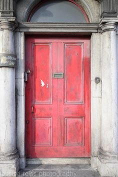 an old red door is shown in this photo