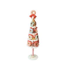 a christmas tree made out of candy canes on a white background with an ornament hanging from the top