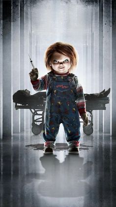 the chucky doll is holding a knife in his hand