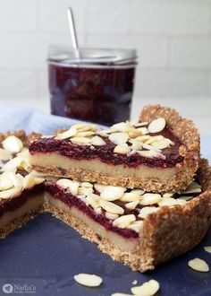 three slices of pie with almonds and blueberry filling