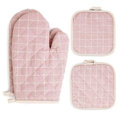 two oven mitts and one pot holder in pink checkered fabric with white piping