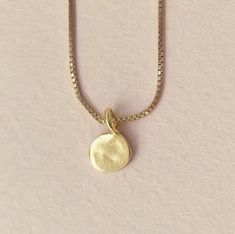 "Dot Necklace, Minimalist Tiny 14k Gold Medallion Disc Necklace, Fine Jewelry This single dot necklace is delicate and minimalist. It is made of 14k//18k gold and has a unique shape of an imperfect circle which adds lots of character and a \"handmade look\". A unique dainty necklace that will look great with any outfit you'll wear and add BLING to your look. It is light and comfortable to wear, perfect for everyday use. Must-have necklace for any style! Material: ♦ 14K gold // 18K gold Measureme Simple Yellow Gold Necklaces With Round Pendant, Simple Yellow Gold Round Pendant Necklaces, Delicate 14k Gold Charm Necklace With Round Pendant, Simple Yellow Gold Tarnish Resistant Necklace, Simple 14k Yellow Gold Necklace, Simple Tarnish Resistant Yellow Gold Necklace, Minimalist Yellow Gold Charm Necklace With Round Pendant, Minimalist Yellow Gold Round Pendant Charm Necklace, Minimalist Yellow Gold Necklace With Round Pendant