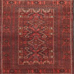 an antique persian rug with red and black colors