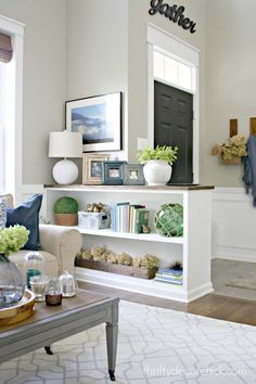 a living room filled with furniture and decor