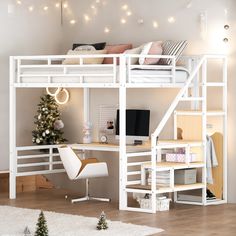 a white loft bed with desk underneath it and christmas decorations on the wall behind it