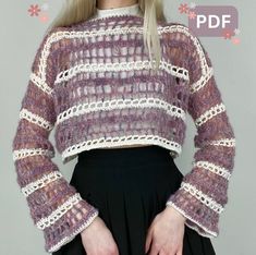 a woman with blonde hair is wearing a purple sweater and black pleated skirt while standing in front of a gray background