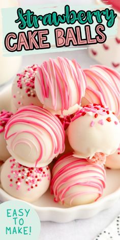 strawberry cake balls on a plate with pink and white sprinkles