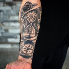 a man's arm with an hour and clock tattoo on it