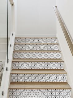 a stair case with geometric tiles on it