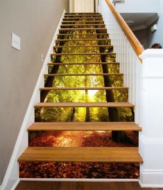 the stairs are painted with trees and leaves