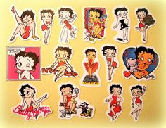 various stickers are displayed on a yellow surface, including women in bathing suits and men in swimsuits