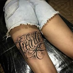 a woman's leg with the words breathe tattooed on it