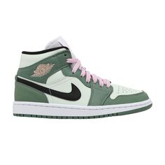 Find JORDAN Wmns 1 Mid Se 'dutch on Editorialist. The women’s Air Jordan 1 Mid SE ‘Dutch Green’ softens the classic silhouette with a spring-ready palette made up of contrasting pastel hues. Varying pale green shades are executed on the leather upper, accented with a black Swoosh and a pink Wings logo on the lateral collar flap. Matching pink hits land on the sneaker’s laces and woven tongue tag, featuring standard Jumpman branding. The mid-top is mounted on a rubber cupsole with encapsulated Nike Air cushioning in the heel. Jordan 1 Mid Dutch Green, Trendy Nike Shoes, Green Jordans, Jordan Mid, Wmns Air Jordan 1, Dr Shoes, Air Jordan 1 Mid Se, Womens Air Jordans, Green Sneakers