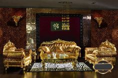 an ornate living room with gold furniture