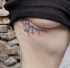 a woman with a tattoo on her stomach