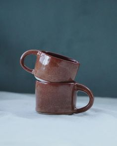 These handmade cups are wheel-thrown using stoneware clay and fired at 1230oC.  It measures approximately * small one - 5 cm in height and 7.5 cm in diameter with approx 120ml capacity. * medium one - 6cm in height and 7.5 cm in diameter with approx 150ml capacity. Its food-safe and lead-free glaze ensures that it's safe for everyday use. This cup is also dishwasher and microwave safe. Handmade Cups, Ceramic Cup, Stoneware Clay, Wheel Thrown, Style Expert, Ceramic Cups, Handmade Ceramic, Food Safe