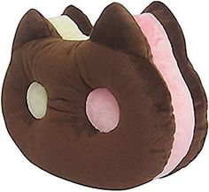 a brown and pink cat pillow with white polka dots