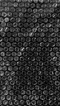 black and white photograph of plastic bottle caps