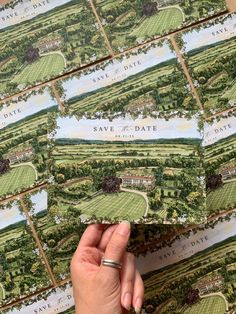 a person holding up some cards that say save the date and golf course on them