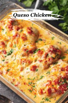 a casserole dish with meatballs and cheese in it, on a table