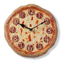 a clock made to look like a pizza with pepperoni and cheese on the crust