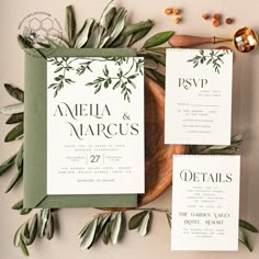 wedding stationery with greenery and calligraphy