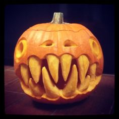 a carved pumpkin with teeth on it