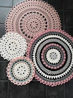 four crocheted doily on the ground