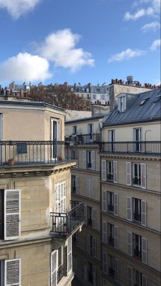 an apartment building with balconies and windows