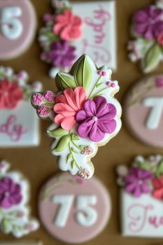 decorated cookies with flowers and numbers on them