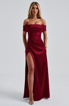 Going out? Enter Gwendolyn, your new favourite gown cut from our luxury stretch satin fabric. Made with an internal boned corset for a snatched waist, the design has a gathered bardot neckline with pleat detailing to the body. The skirt falls to an elegant maxi length, detailed with a wrap over style and thigh high split. 



Colour: Burgundy.

Premium stretch satin.

Gathered bardot neckline.

Pleat detailing to body.

Internal boned corset.

Wrap over skirt.

Thigh high split.

Invisible zippe Corset Bridesmaid Dresses, Prom Dresses Dark Red, Dresses Dark Red, Wrap Over Skirt, Summer Prom Dress, Burgundy Gown, Midi Dress Wedding Guest, Black Tie Attire, Snatched Waist