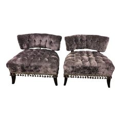 a pair of grey velvet chaise lounge chairs