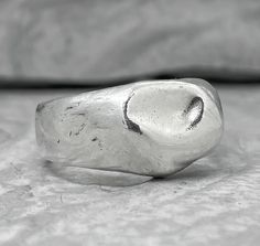 "At the moment we have difficulties with the payment system and we only accept payment through PAYPAL. When placing an order, select PAYPAL as a payment method. Otherwise, we will have to cancel your order. Thank you for understanding! ... liquid Ring Material: 925 Sterling Silver Processing Type: Volcanic oxidation+Polishing Width 6-7 mm, Weight about 8-9 grams. Description: The wide band of silver resembles liquid metal. The glossy texture becomes matte over time and acquires a unique texture Silver Hand Forged Wide Band Open Ring, Silver Hand-forged Wide Band Ring For Anniversary, Hand Forged Silver Ring With Thick Band, Silver Signet Ring With Thick Band For Wedding, Minimalist Hand Cast Silver Engraved Ring, Minimalist Silver Engraved Hand-cast Ring, Silver Signet Ring With Thick Band As Gift, Silver Signet Ring With Open Band As Gift, Silver Open Band Signet Ring As Gift