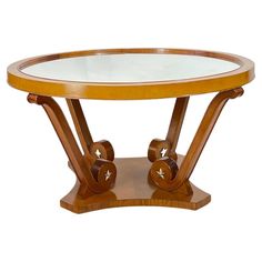 a wooden and glass table with wheels on it