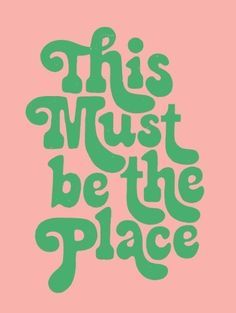 the words, this must be the place are green on pink background with black lettering