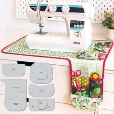 a sewing machine sitting on top of a counter next to some pieces of fabric and scissors