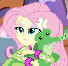 pinkie and her alligator are hugging each other